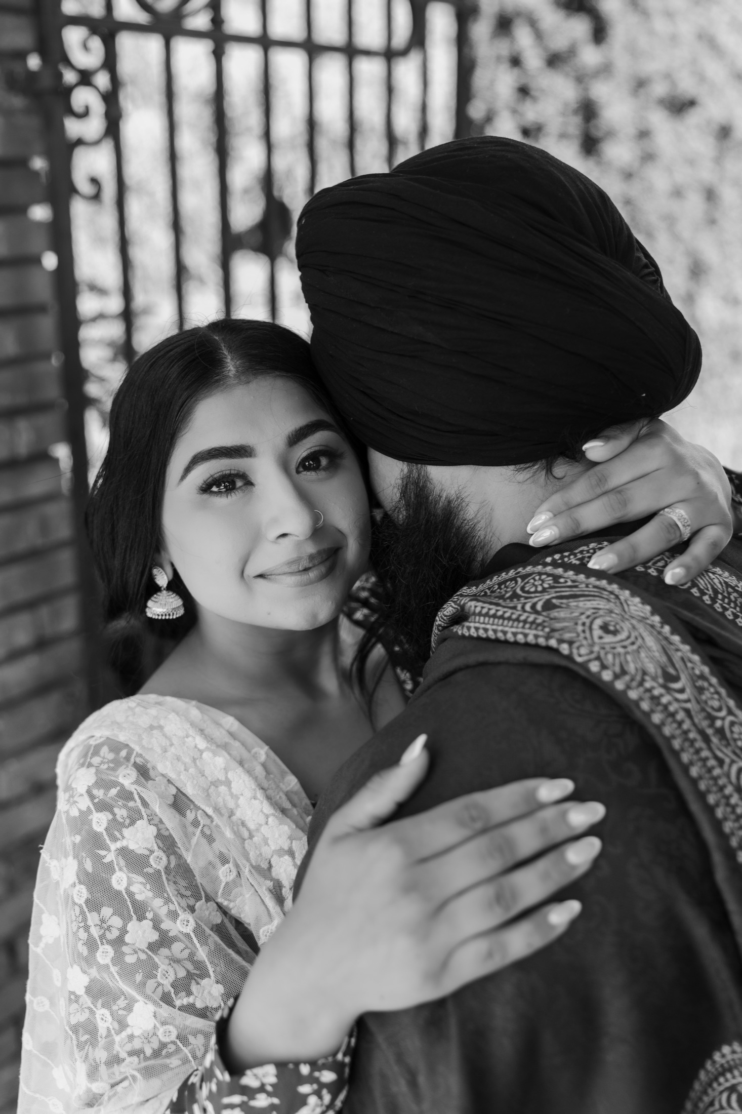 An intimate black-and-white portrait of Harjinder and Karmjit